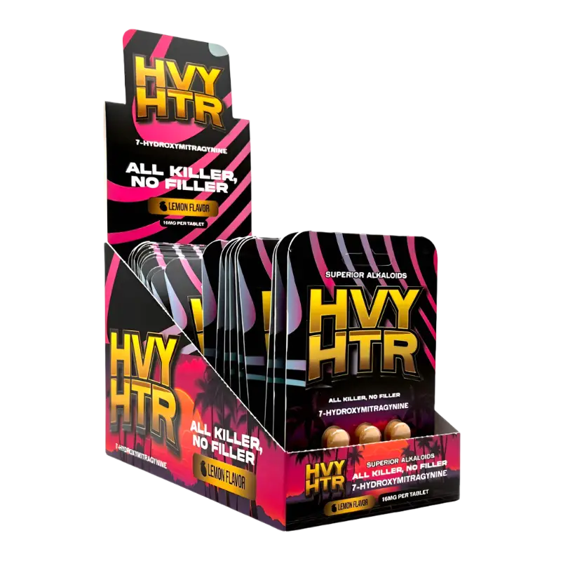 Display box containing packets of HVY HTR pre-workout supplement with black and pink packaging.