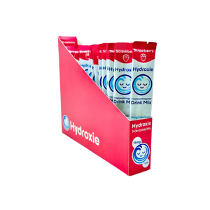 Red retail display box containing Hydroxie drink mix packets.