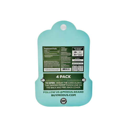 Mint green plastic cutting board with product information printed on it.