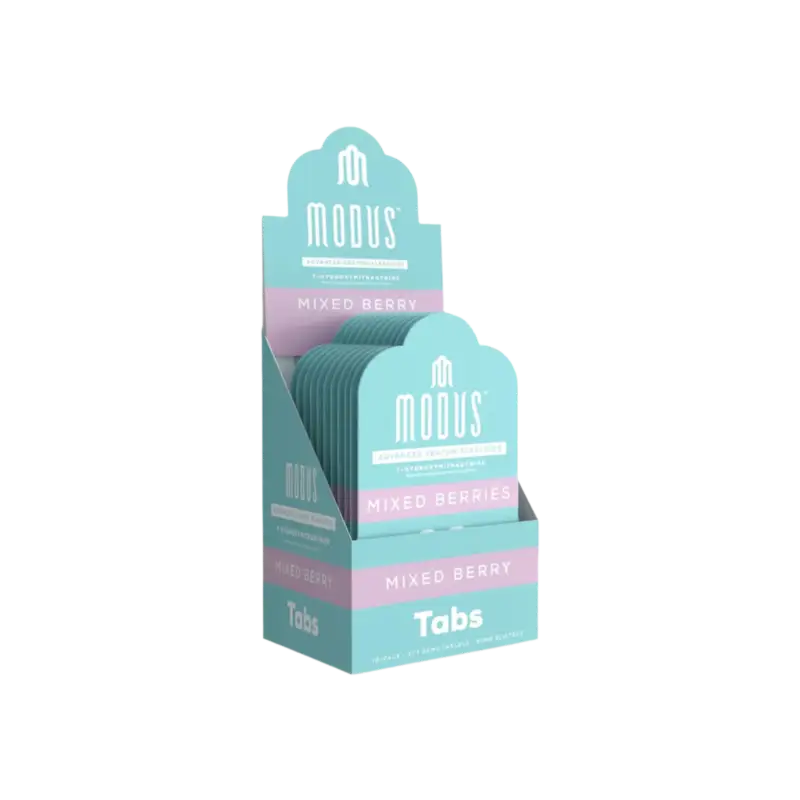 Product display box containing Modus mixed berry tabs in turquoise and pink packaging.