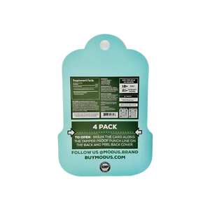 Mint green plastic cutting board with product information printed on the back.