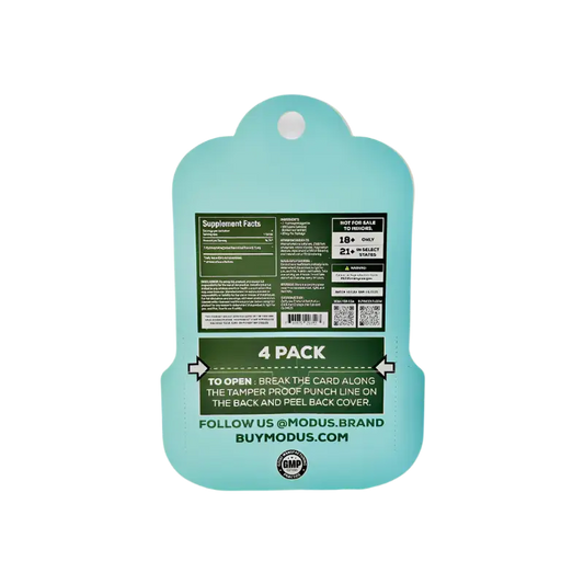 Mint green plastic cutting board with product information printed on the back.