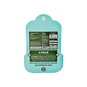 Mint green plastic cutting board with product information printed on the back.