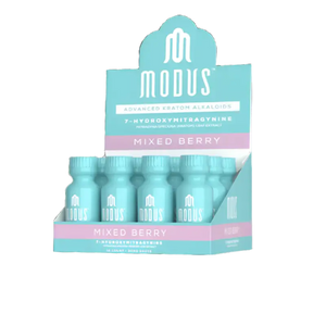 Display box containing Modus Mixed Berry drink bottles in turquoise and pink colors.