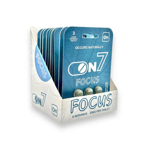 Display box containing ON7 Focus supplement packets in blue and white packaging.