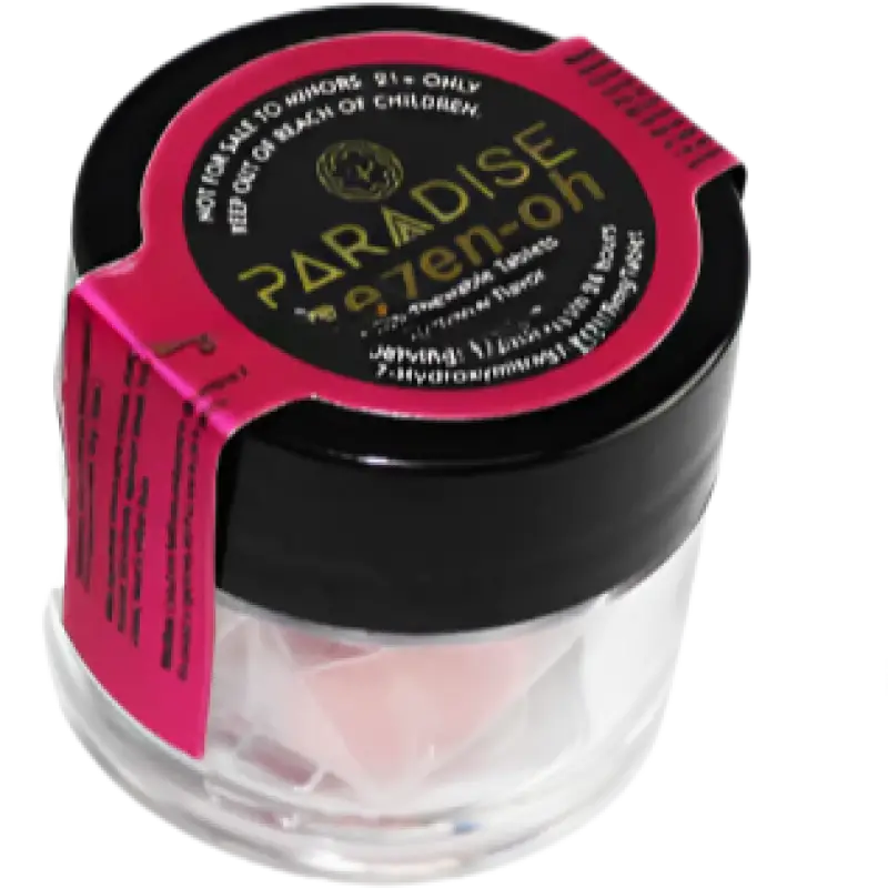 Clear jar with a black lid and pink label containing Paradise Makeup.