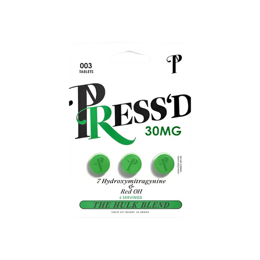 Stylized product packaging design for ’Press’d 30MG’ featuring green pills and text.